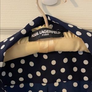 Polka dot sleeveless blouse.